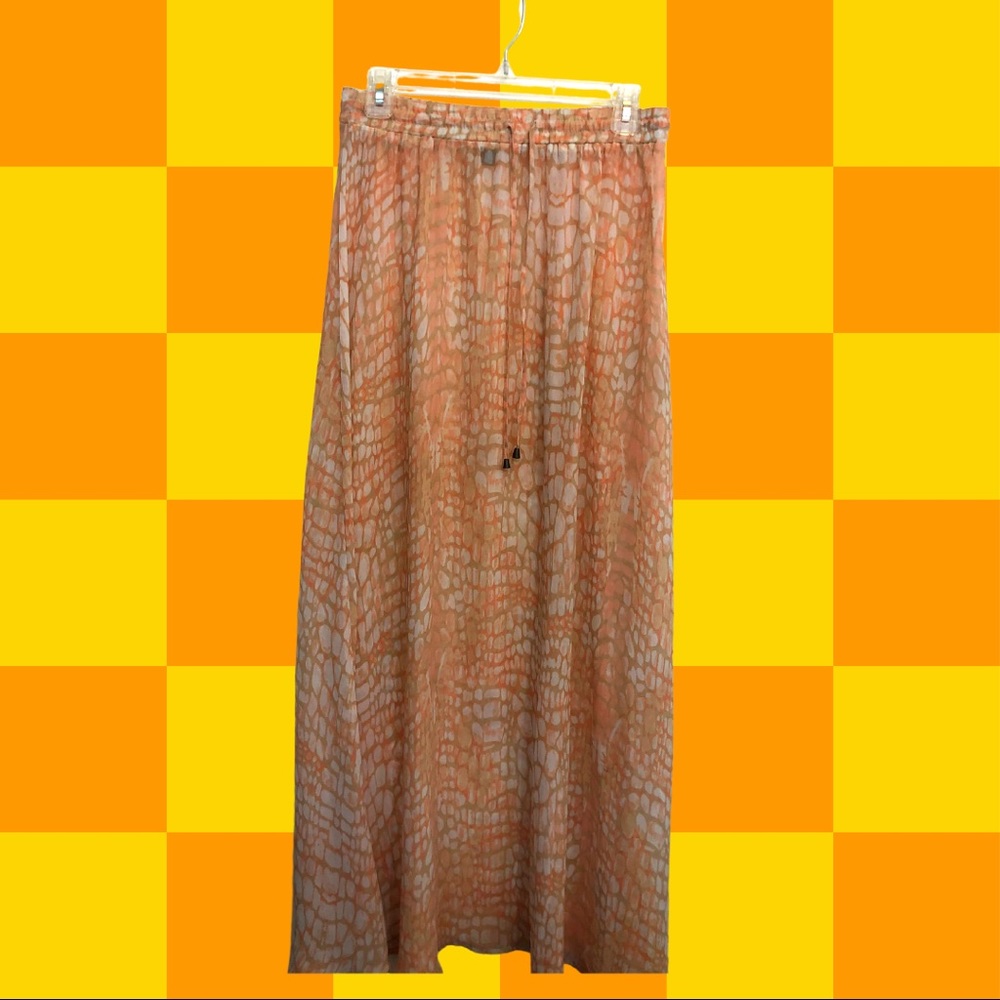 Slightly sheer flowy maxi skirt with orange snake print. Size: S but can fit M-L
